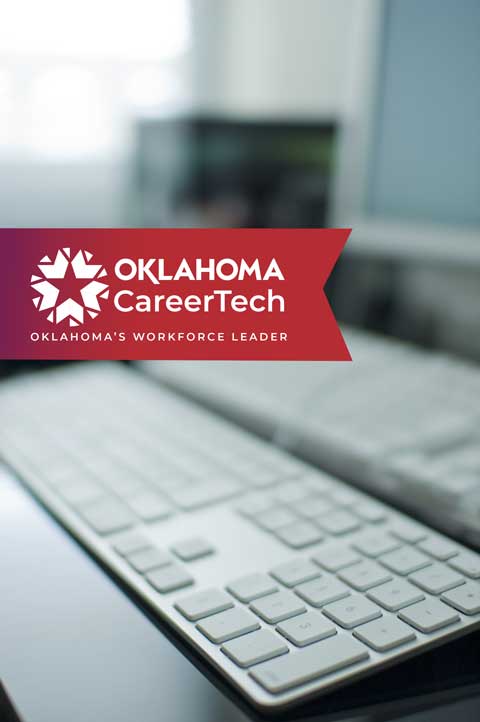 Oklahoma CareerTech logo with a blurred desktop computer in the background