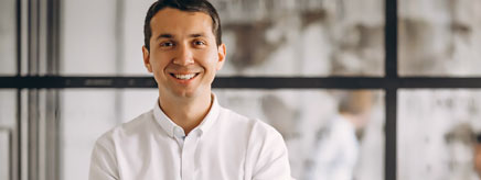 A parent stands near a classroom.