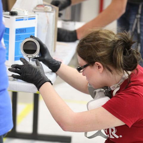 Student measures substance in preparation for project